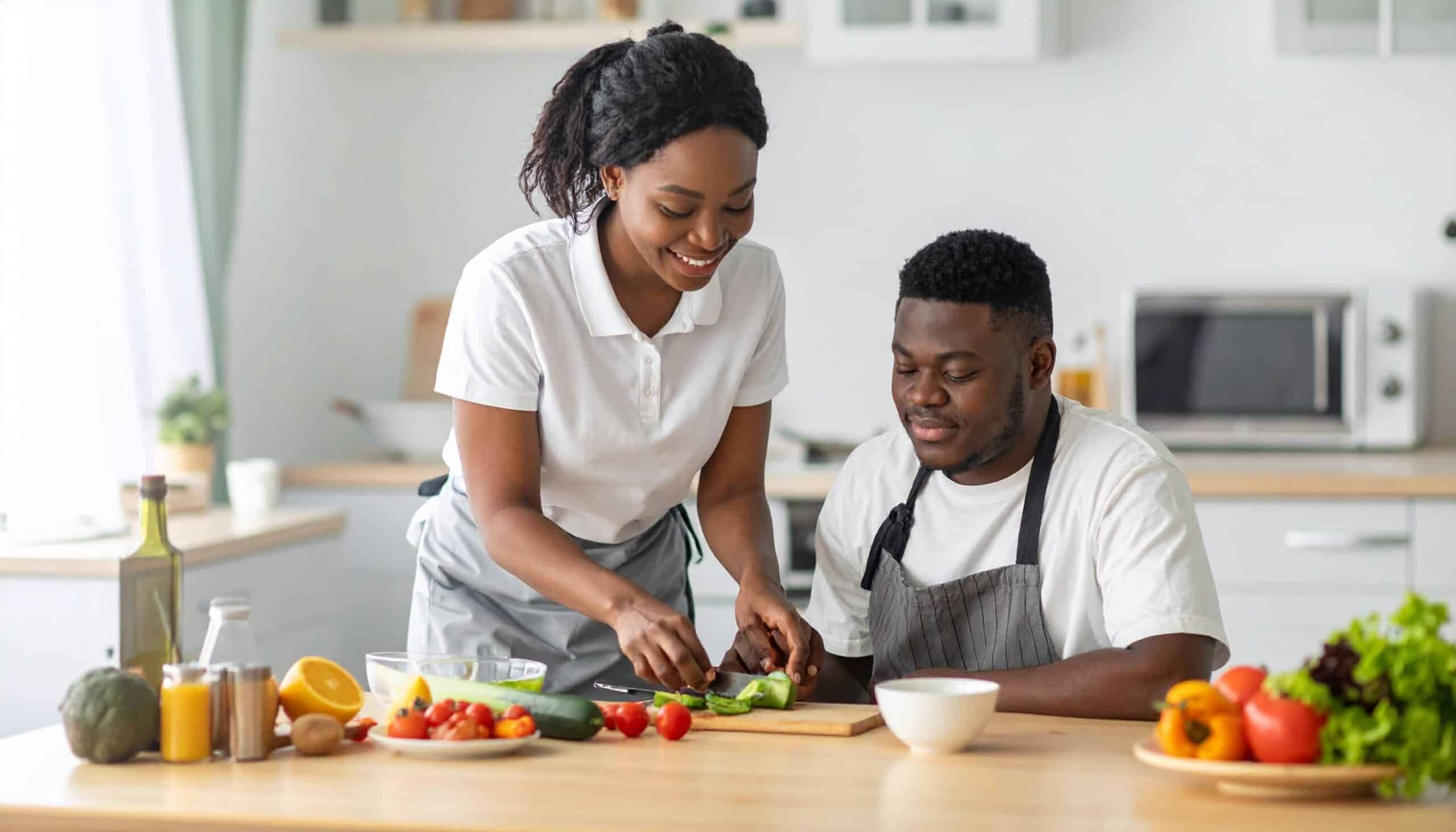 Direct support professional guiding an individual during an in-home activity