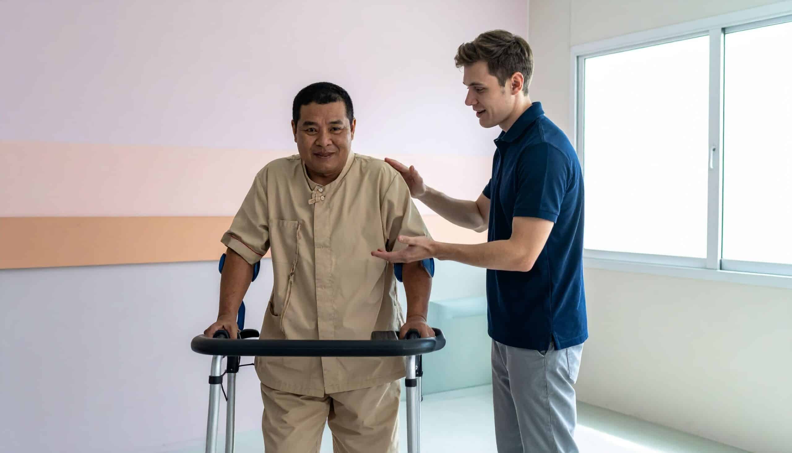 Direct support professional assisting an individual in a therapy room